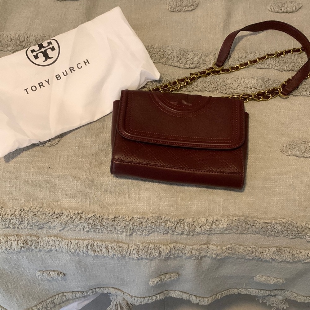 8in by 5 in burgundy Tory Burch purse never used